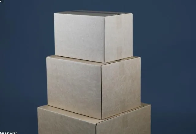 Stacked cardboard moving boxes ready to load